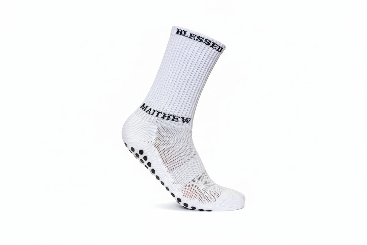 White athletic socks with grip dots and biblical references for sports apparel