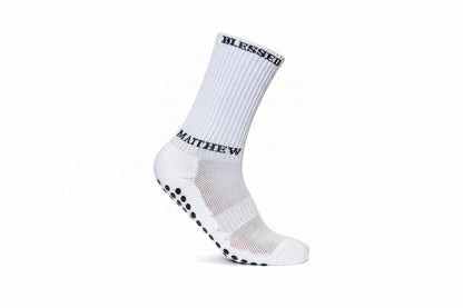 White athletic socks with grip dots and biblical references for sports apparel